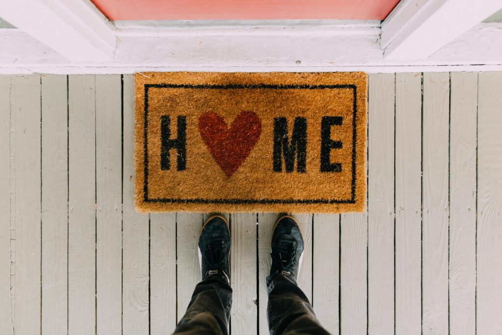 A welcome mat at the front door of a home