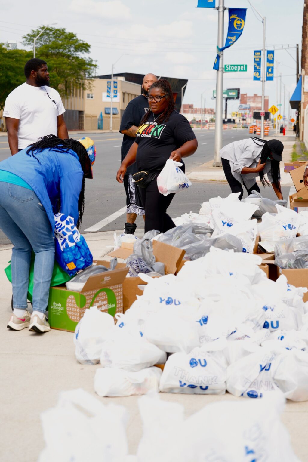 Volunteers packing bags of groceries