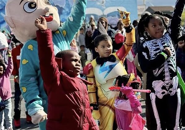 Kids in Halloween costumes cheering at DABO Detroit's Hallowed Eve