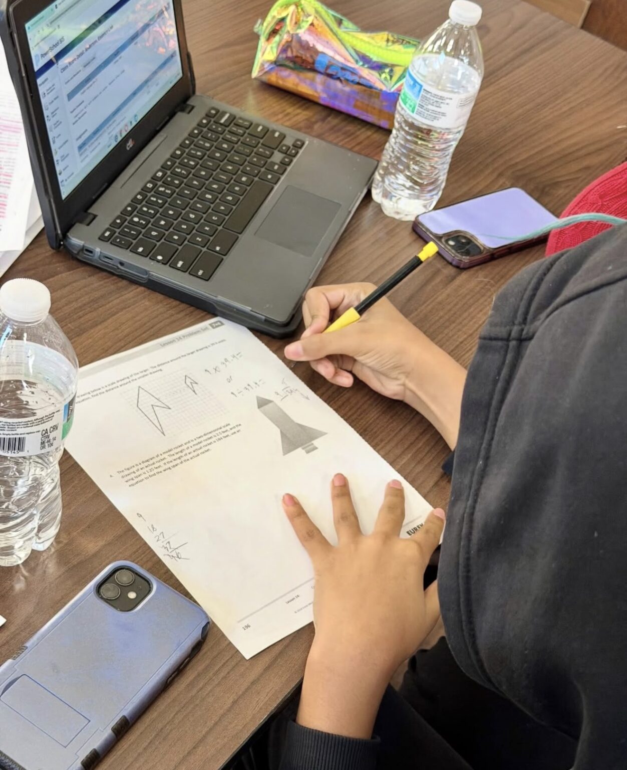 A student working on a math worksheet during homework time